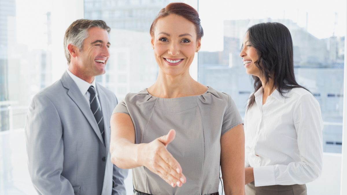 Lady shaking hand. Best AI Tools for Marketers featured image
