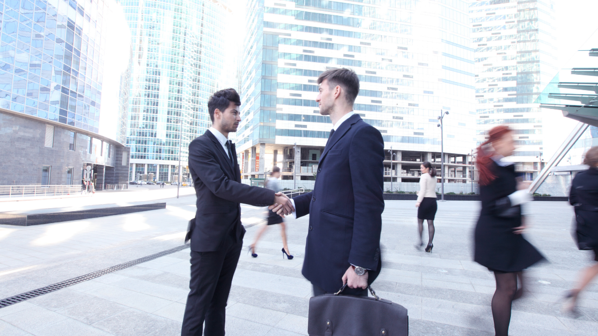 best email marketing tools for small businesses featured image - business hand shake